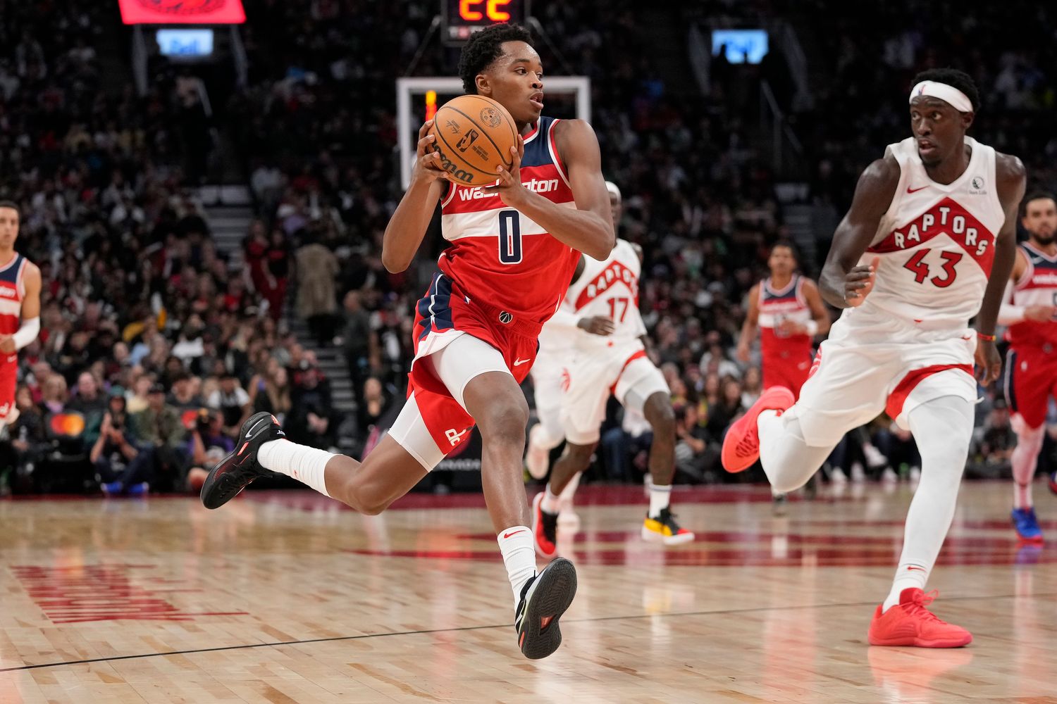 Washington Wizards guard Bilal Coulibaly (0) drives to the net against Toronto Raptors forward Pascal Siakam (43) during the second half at Scotiabank Arena.